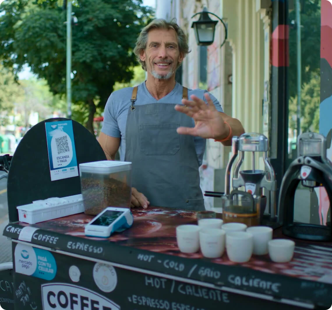 A photo of a man at a coffee stand